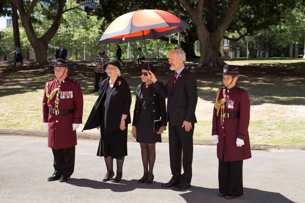 ANZ_YPRES_2017_047c Officials -Margaret Snodgrass, Dame Marie Bashir, Jim Munro with Poppy umbrella and Corps of Guards Iain Finlay & Pam Richardson